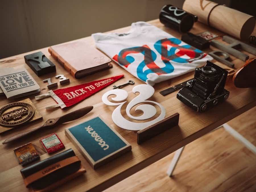 Assorted vintage items and stationery spread out on a wooden surface.